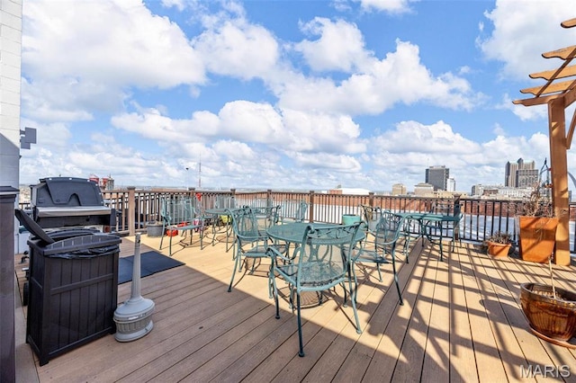 wooden deck with outdoor dining area