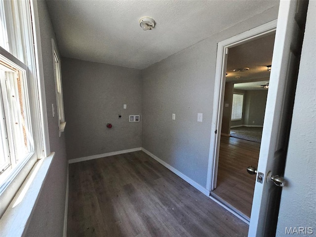 828 W Elk St, Dexter, MO 63841 - laundry area with wood finished floors, baseboards, and a textured ceiling