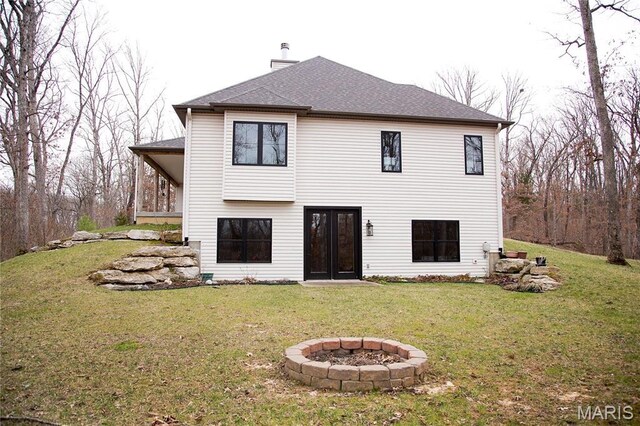3 Inland Ct, Wright City, MO 63390 - back of house featuring an outdoor fire pit, a lawn, a chimney, and a shingled roof