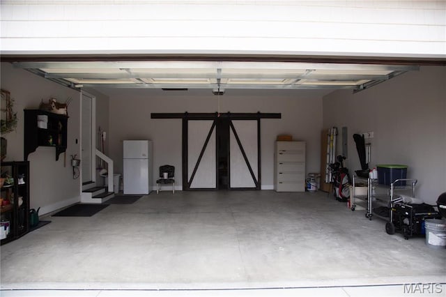 3 Inland Ct, Wright City, MO 63390 - garage with freestanding refrigerator and a garage door opener