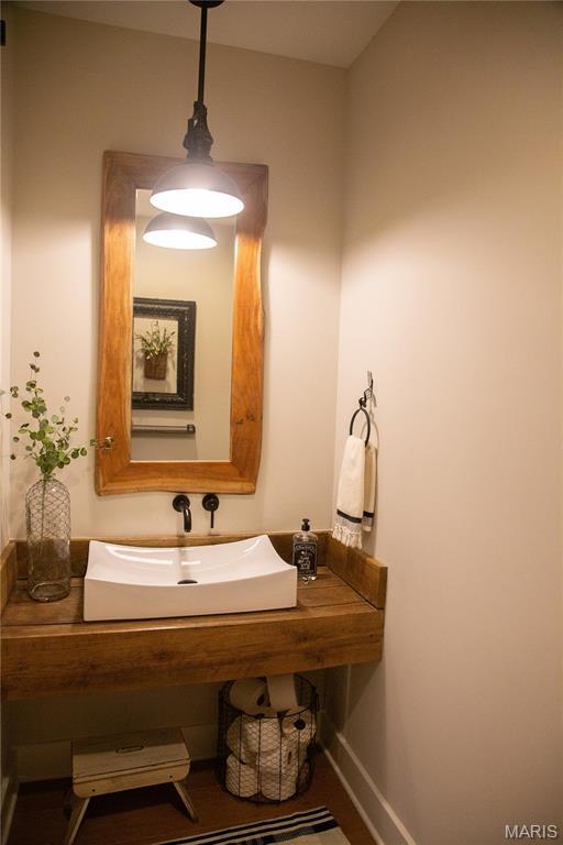 3 Inland Ct, Wright City, MO 63390 - bathroom featuring a sink and baseboards