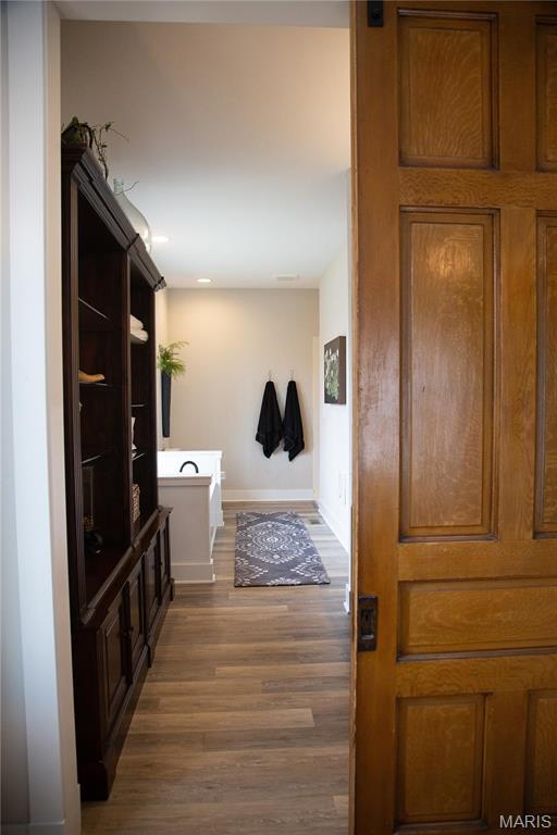 3 Inland Ct, Wright City, MO 63390 - hall featuring dark wood-type flooring and baseboards