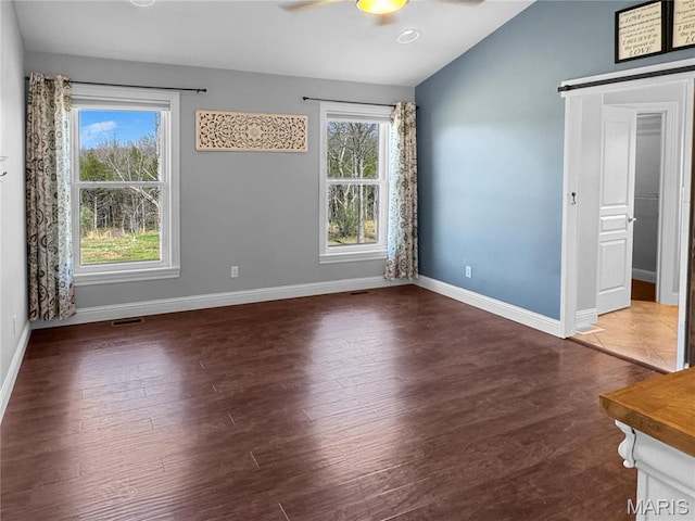 641 Ponderosa Trl, Beaufort, MO 63013 - spare room with lofted ceiling, a ceiling fan, healthy amount of natural light, and baseboards