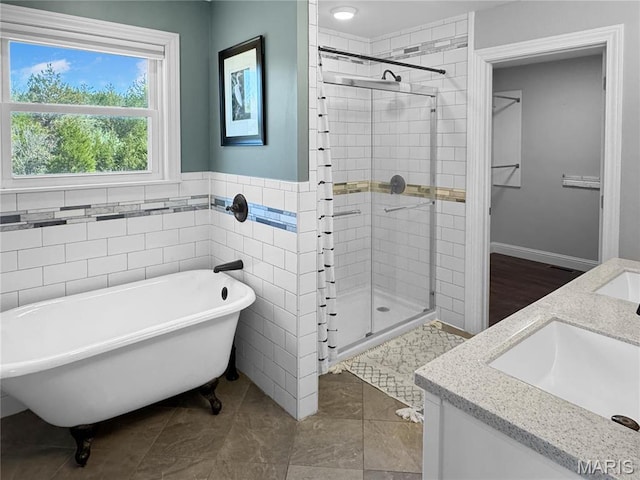 641 Ponderosa Trl, Beaufort, MO 63013 - full bath with a stall shower, double vanity, a freestanding tub, and tile walls