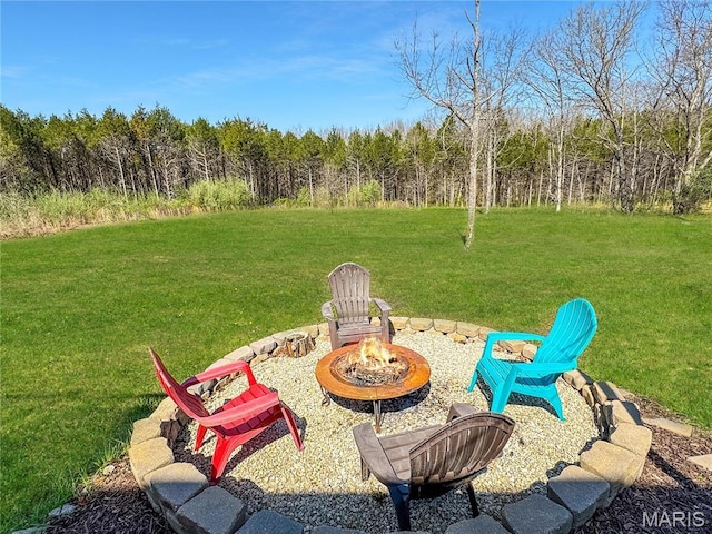 641 Ponderosa Trl, Beaufort, MO 63013 - view of green lawn with a fire pit and a forest view