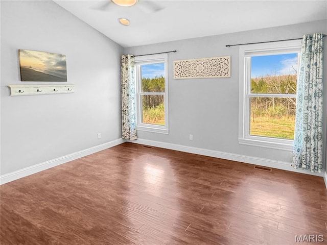 641 Ponderosa Trl, Beaufort, MO 63013 - spare room with lofted ceiling, wood finished floors, and baseboards