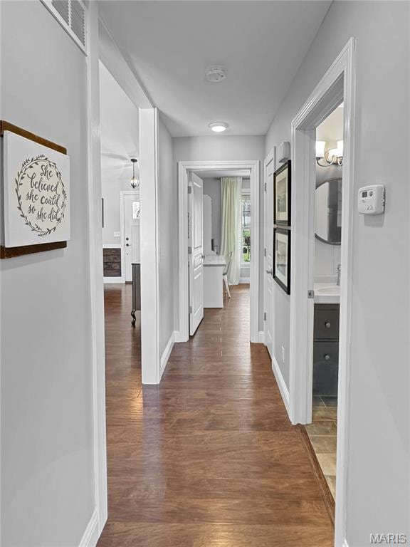 641 Ponderosa Trl, Beaufort, MO 63013 - hallway featuring dark wood-style flooring, baseboards, and a sink