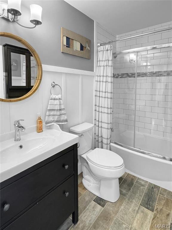 641 Ponderosa Trl, Beaufort, MO 63013 - full bath with toilet, shower / bath combo with shower curtain, vanity, wood finished floors, and wainscoting