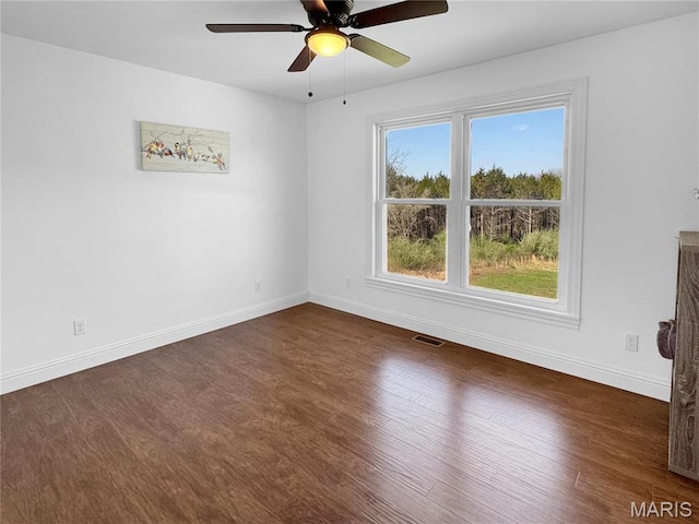 641 Ponderosa Trl, Beaufort, MO 63013 - unfurnished room with dark wood-style flooring, ceiling fan, and baseboards