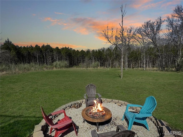 641 Ponderosa Trl, Beaufort, MO 63013 - view of grassy yard featuring an outdoor fire pit