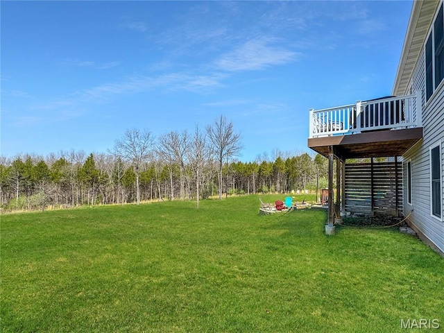 641 Ponderosa Trl, Beaufort, MO 63013 - view of green lawn with a deck and a view of trees