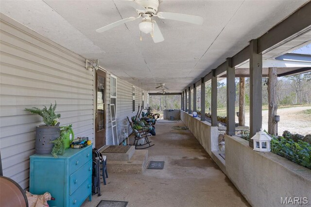 10303 Woodberry Rd, Potosi, MO 63664 - unfurnished sunroom featuring ceiling fan and plenty of natural light