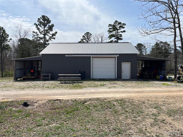 10303 Woodberry Rd, Potosi, MO 63664 - garage with driveway and a detached garage