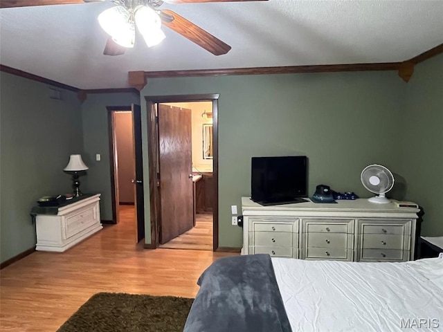 10303 Woodberry Rd, Potosi, MO 63664 - bedroom with ornamental molding, wood finished floors, ceiling fan, baseboards, and connected bathroom