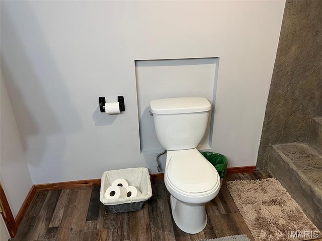 10303 Woodberry Rd, Potosi, MO 63664 - bathroom featuring toilet, wood finished floors, and baseboards
