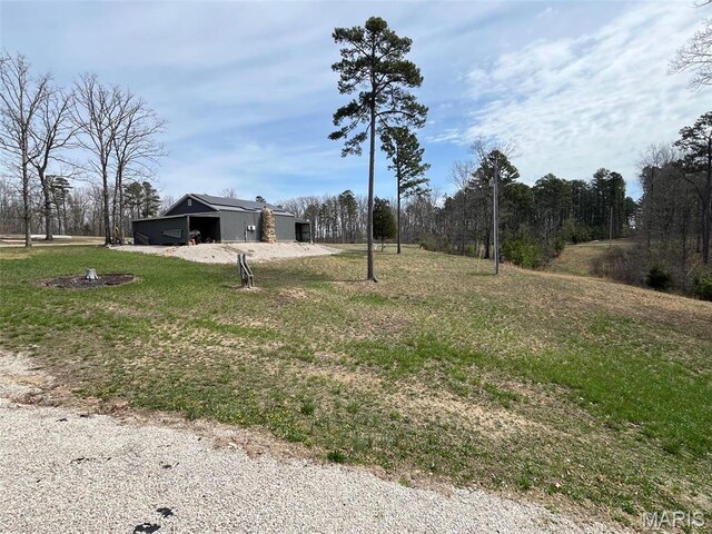 10303 Woodberry Rd, Potosi, MO 63664 - view of grassy yard featuring a pole building and an outdoor structure