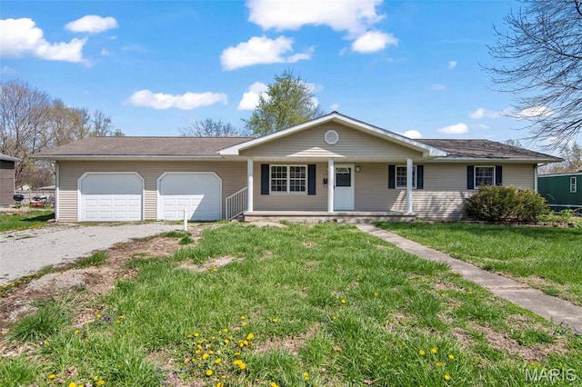 1112 N Illinois Ave, Litchfield, IL 62056 - ranch-style home with covered porch, an attached garage, gravel driveway, and a front yard