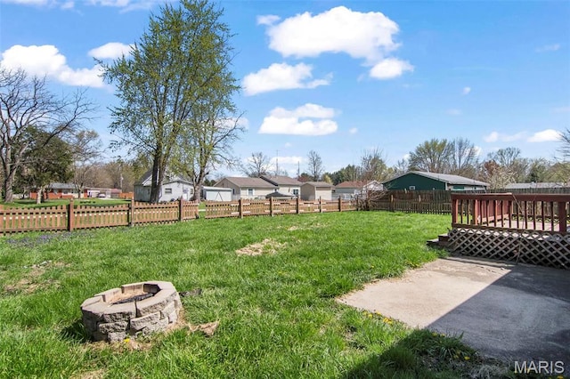 1112 N Illinois Ave, Litchfield, IL 62056 - view of yard featuring a fire pit, a wooden deck, and a patio area