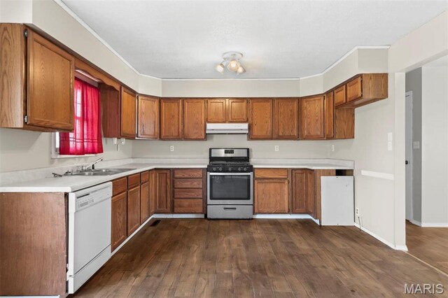 1112 N Illinois Ave, Litchfield, IL 62056 - kitchen featuring stainless steel gas range, under cabinet range hood, white dishwasher, and brown cabinets