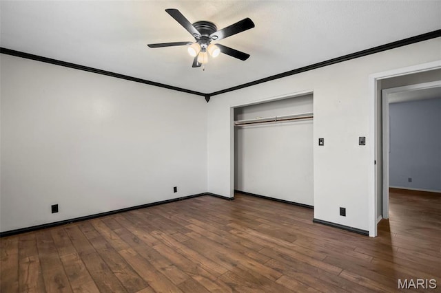 1112 N Illinois Ave, Litchfield, IL 62056 - unfurnished bedroom featuring crown molding, baseboards, wood finished floors, a closet, and a ceiling fan