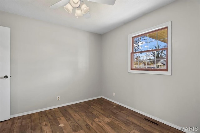 1112 N Illinois Ave, Litchfield, IL 62056 - spare room with a ceiling fan, wood finished floors, and baseboards