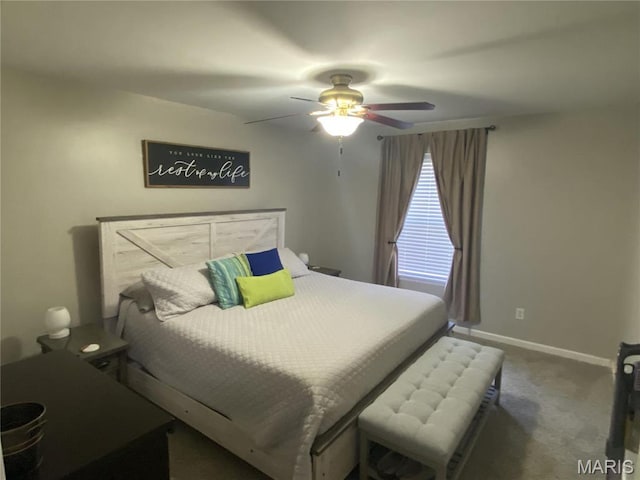 carpeted bedroom featuring baseboards and ceiling fan