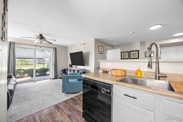 kitchen with black dishwasher, a sink, dark wood-type flooring, white cabinetry, and ceiling fan