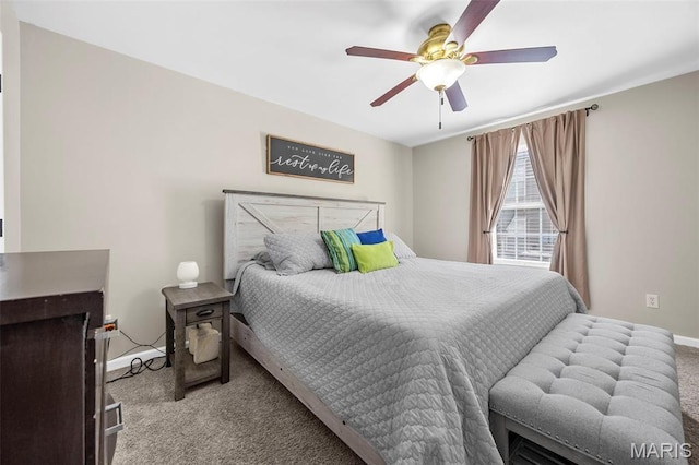 carpeted bedroom with baseboards and ceiling fan