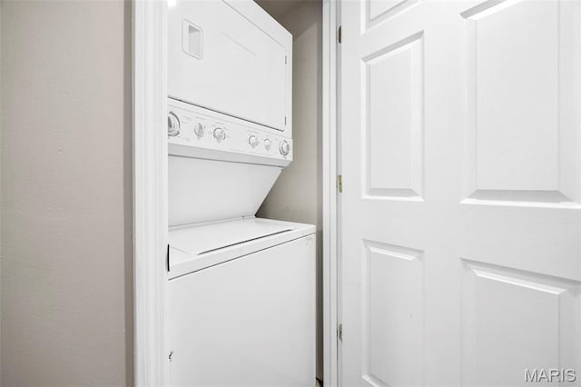 washroom with estacked washer and dryer