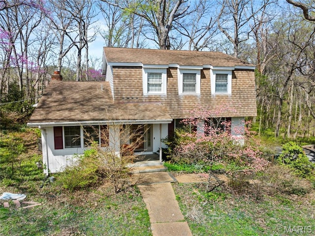 1536 S Mason Rd, Saint Louis, MO 63131 - view of front of property with a shingled roof and a chimney