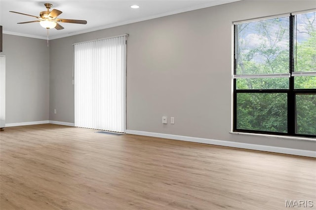 11148 Whispering Oaks Dr, Saint Louis, MO 63136 - spare room with plenty of natural light, baseboards, ornamental molding, light wood-style floors, and recessed lighting