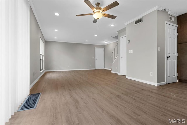 11148 Whispering Oaks Dr, Saint Louis, MO 63136 - unfurnished living room featuring a ceiling fan, crown molding, baseboards, wood finished floors, and recessed lighting