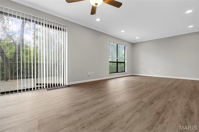 11148 Whispering Oaks Dr, Saint Louis, MO 63136 - spare room featuring ornamental molding, baseboards, wood finished floors, ceiling fan, and recessed lighting