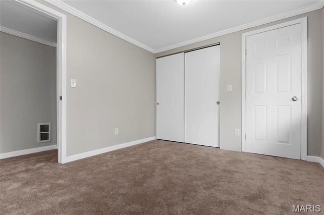 11148 Whispering Oaks Dr, Saint Louis, MO 63136 - unfurnished bedroom featuring carpet floors, crown molding, baseboards, and a closet