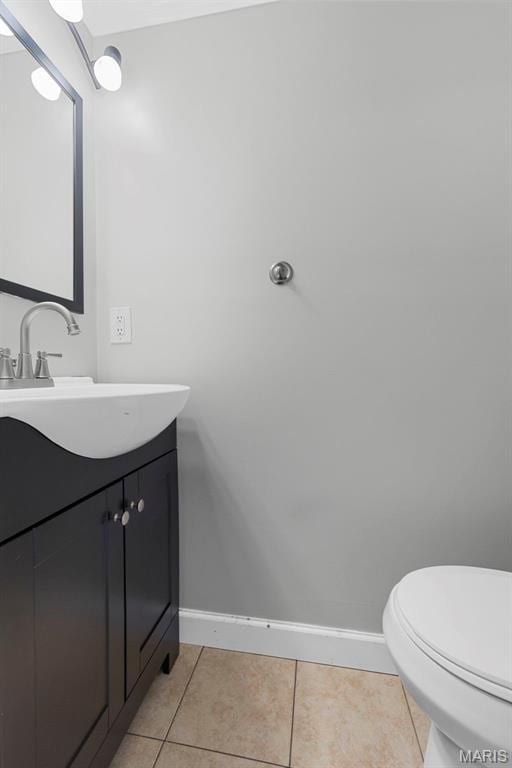 11148 Whispering Oaks Dr, Saint Louis, MO 63136 - half bathroom with baseboards, tile patterned flooring, vanity, and toilet
