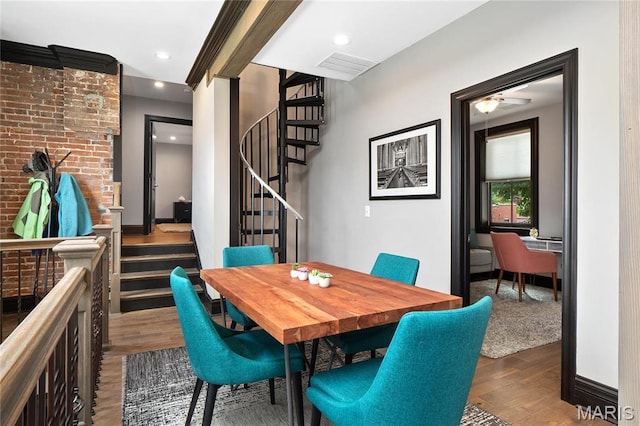 dining area featuring wood finished floors, stairs, recessed lighting, and a ceiling fan