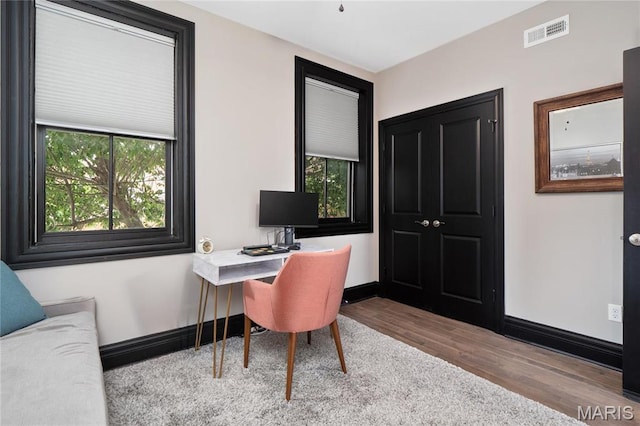 office area featuring wood finished floors and baseboards
