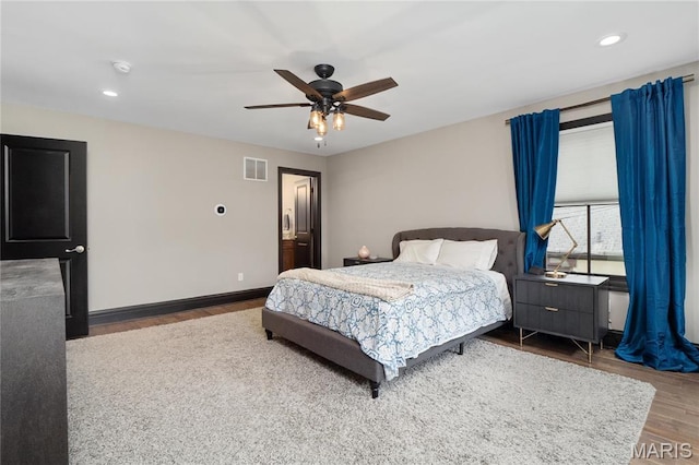 bedroom featuring wood finished floors, ceiling fan, recessed lighting, and baseboards