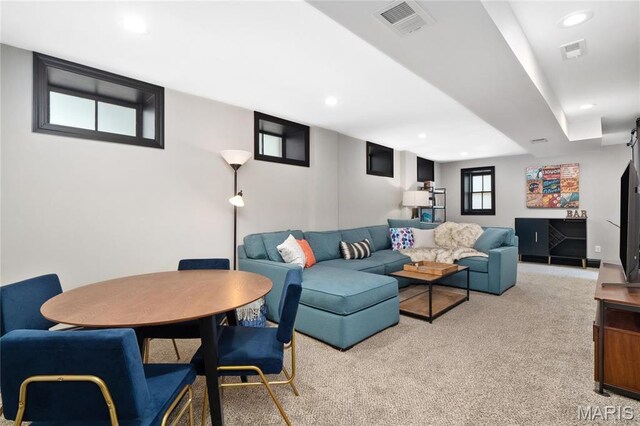 living room featuring light carpet and recessed lighting