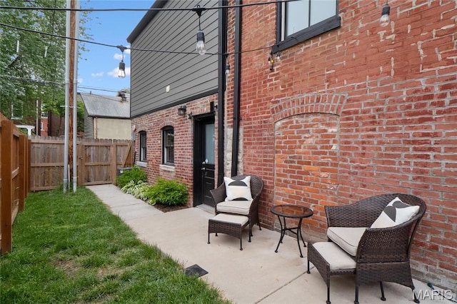 view of patio / terrace featuring fence