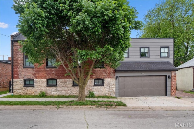 view of front of home featuring a garage, concrete driveway, brick siding, and a shingled roof