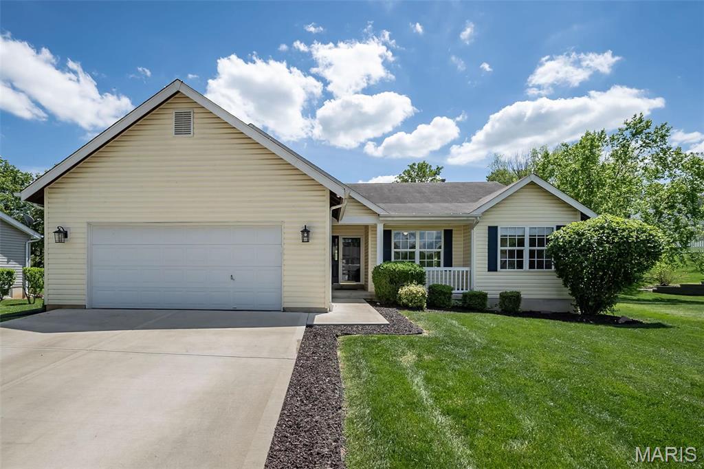 170 Valleybrook Dr, Ofallon, MO 63368 - single story home with concrete driveway, a front lawn, and an attached garage