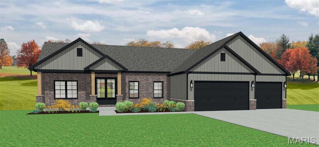 view of front of house featuring a front lawn, brick siding, a garage, and driveway