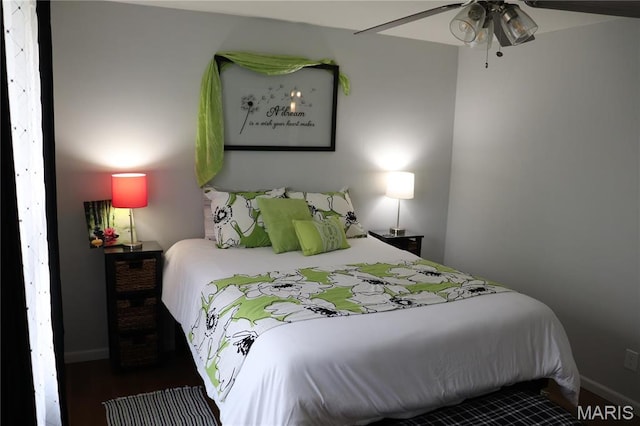 bedroom featuring baseboards and ceiling fan