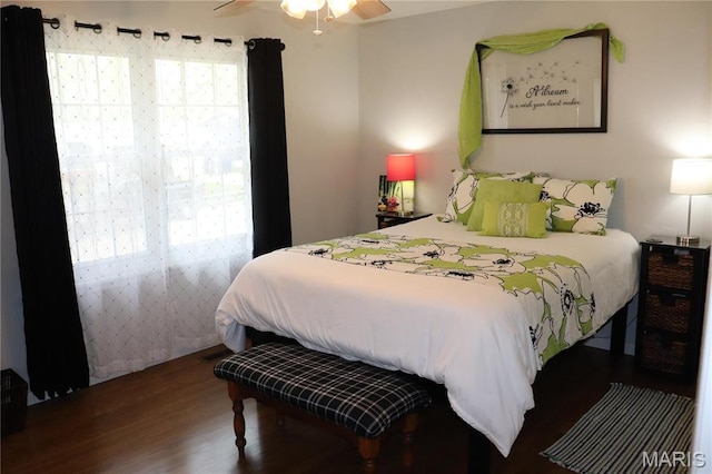bedroom with wood finished floors and a ceiling fan