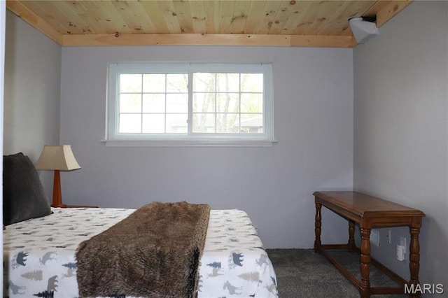 carpeted bedroom featuring wooden ceiling