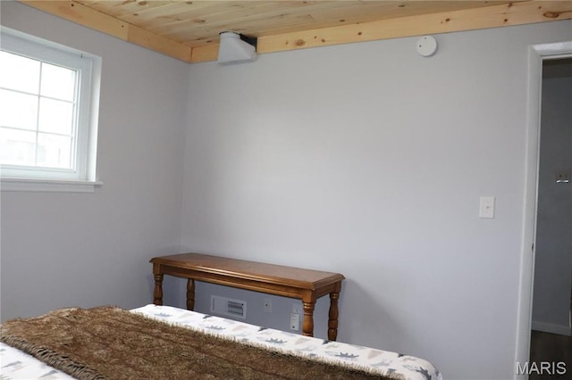 bedroom featuring wood ceiling