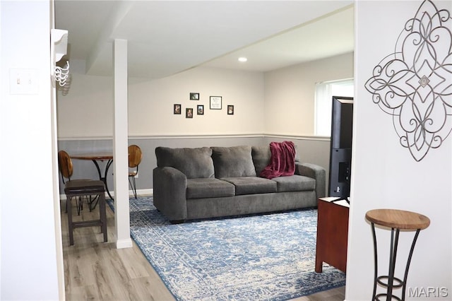 living area featuring wood finished floors and recessed lighting