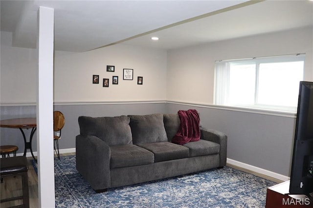 living room with baseboards and recessed lighting