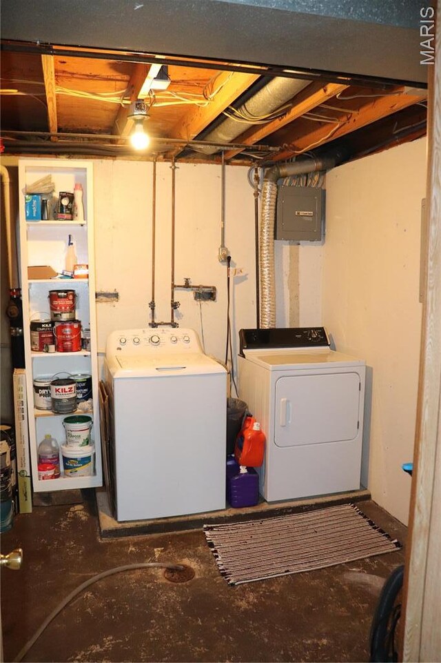 laundry area with separate washer and dryer and electric panel